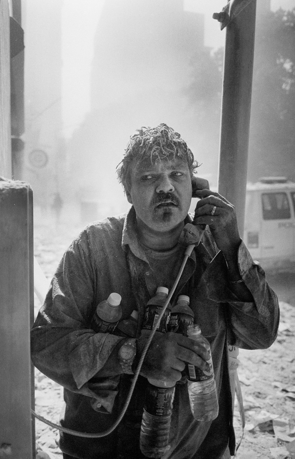 Jason Florio, Photographer: Man Using a Lower Manhattan Payphone on September 11, 2001.