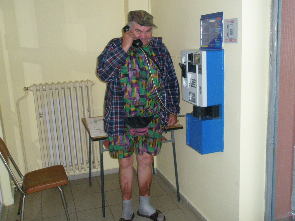 Mirošov, Czech Republic. Payphone user.